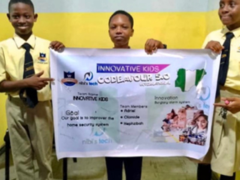 Students holding their team poster for the Codeavour competition